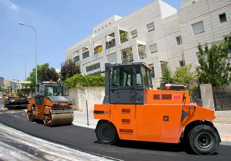 Paving equipment at a commercial location